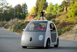 Compact Autonomous Car On Road.jpg Wallpaper