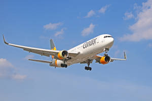 Condor Airlines Flying Airplane Up In The Sky Wallpaper