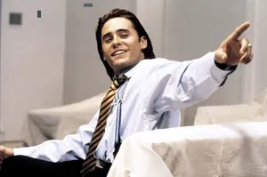 Confident Man Pointing Smiling Wallpaper