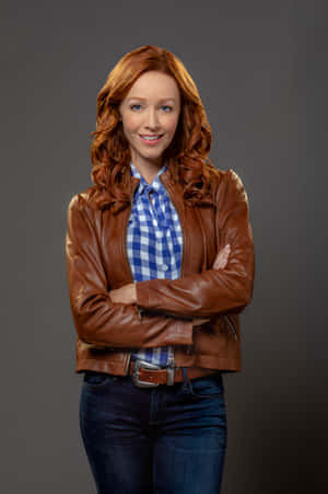 Confident Redheadin Leather Jacket Wallpaper