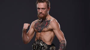 Conor Mcgregor With Ufc Belt Wallpaper