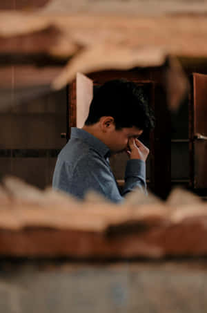 Contemplative_ Man_ In_ Ruins.jpg Wallpaper