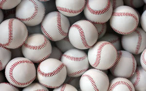 Cool Baseball Balls With Red Stitches Wallpaper