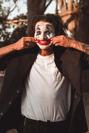 Cool Joker Forcing A Smile Wallpaper