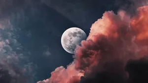 Cool Moon Through Red Clouds Wallpaper