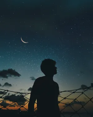 Cool Sad Boy During Starry Night Wallpaper