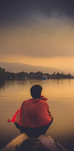 Cool Sad Boy On A Boat Wallpaper