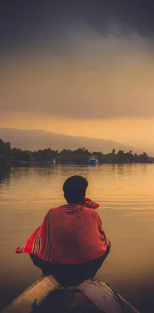 Cool Sad Boy On A Boat Wallpaper