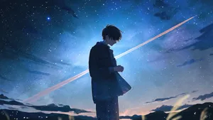 Cool Sad Boy Under The Stars Wallpaper