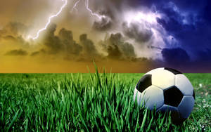 Cool Soccer Ball At Grassland Wallpaper