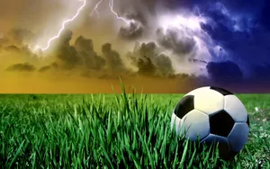 Cool Soccer Ball At Grassland Wallpaper