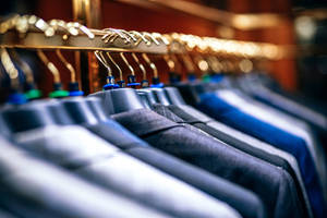 Corporate Clothes On Wire Rack Wallpaper