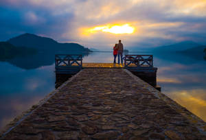 Couple Back View At The Sea Wallpaper