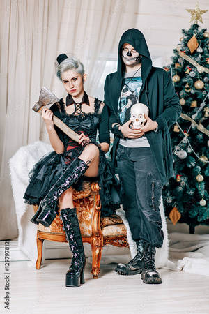 Couple Celebrating A Gothic Christmas Wallpaper