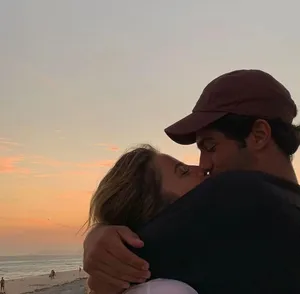 Couple Enjoying A Romantic Moment Together Wallpaper