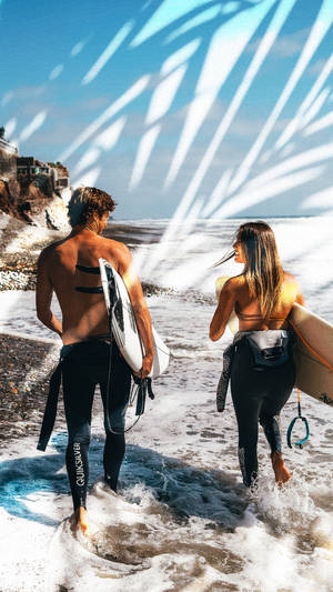 Couple Going Surfing Wallpaper