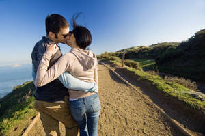 Couple's Romantic Love On A Hill Wallpaper