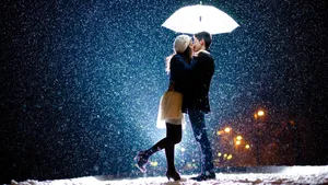 Couple Sharing Umbrella Love Story Wallpaper