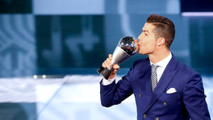 Cr7 Hd Kissing Trophy Wallpaper