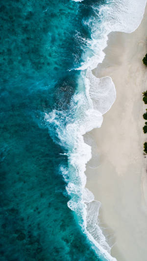 Crashing Wave On Sandy Beach Wallpaper