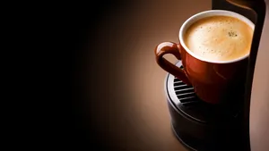 Creamy Coffee In A Coffee Cup Wallpaper