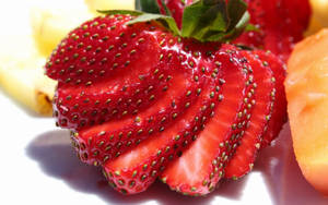 Creatively Sliced Strawberry Wallpaper