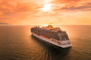 Cruise Ship Orange Sunset Wallpaper