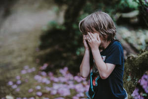 Crying Sad Boy At The Garden Wallpaper