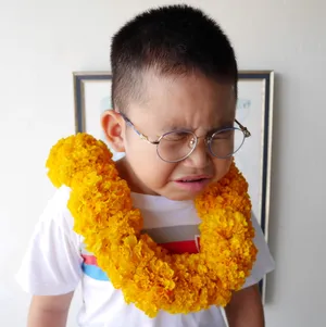 Crying Sad Boy With Garland Wallpaper