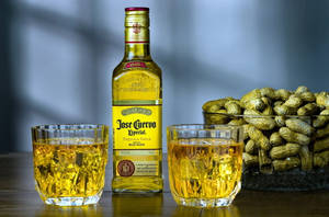 Cuervo Tequila Bottle With Peanuts Wallpaper