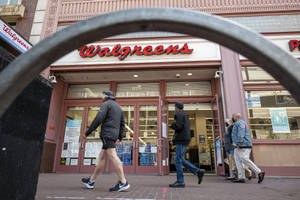 Customers Shopping At A Bustling Walgreens Store Wallpaper