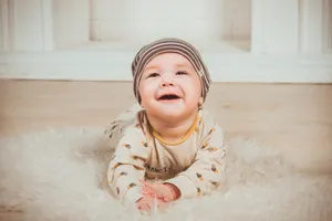 Cute Baby With A Wide Smile Wallpaper