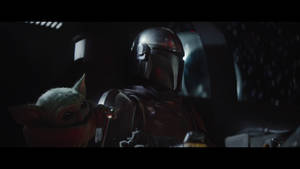 Cute Baby Yoda With Mandalorian Wallpaper