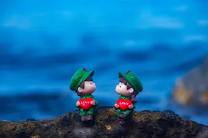 Cute Blue Couple Toy Figures Wallpaper