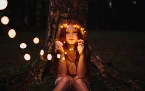 Cute Girl With Light Decorations Wallpaper
