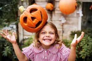 Cute Halloween Pumpkin On Girl's Head Wallpaper