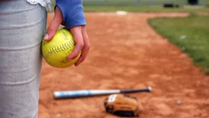 Cute Softball In Hand Wallpaper