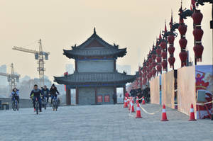 Cyclists On Xian City Wall Wallpaper