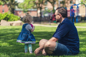 Dad And Daughter In Park Wallpaper