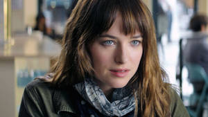 Dakota Johnson Tantalizing Blue Eyes Wallpaper