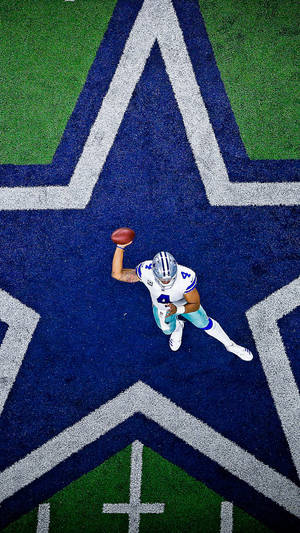 Dallas Cowboys Player Throwing A Ball Wallpaper
