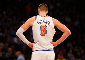 Dallas Mavericks Star Kristaps Porzingis With Jersey Number 6 Wallpaper