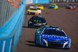 Daniel Suarez's Leading Blue Car Wallpaper