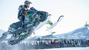 Daring Snowmobile Stunt At X Games Wallpaper