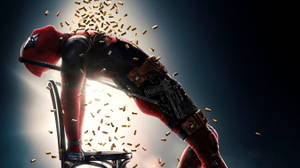 Deadpool On A Chair Hollywood Movie Wallpaper