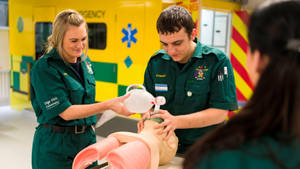 Dedicated And Skilled Paramedic Administering Cpr Wallpaper