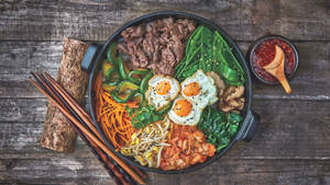 Delectable Bibimbap Feast For Three Wallpaper