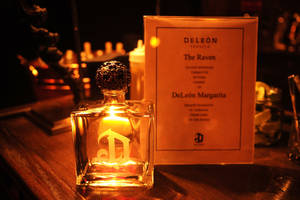 Deleón Tequila Bottle With Bar Menu Wallpaper