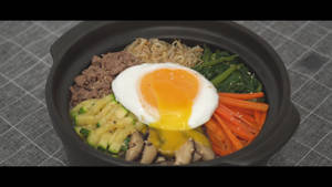 Delicious Bibimbap With Runny Egg Wallpaper