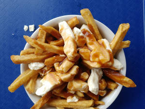 Delicious Bowl Of Homemade Poutine Wallpaper